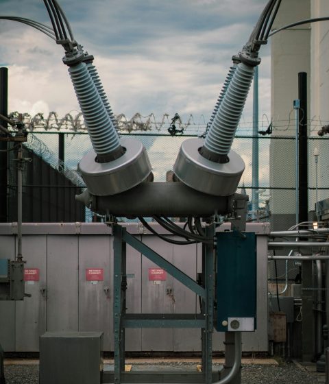 Close-up of a high voltage transformer with barbed wire in New York City.